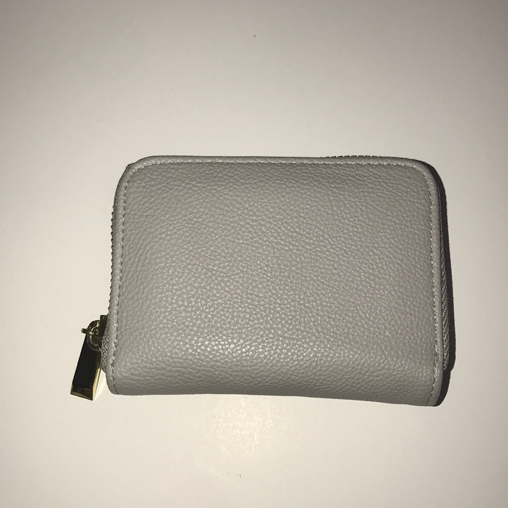 Light grey faux leather wallet.